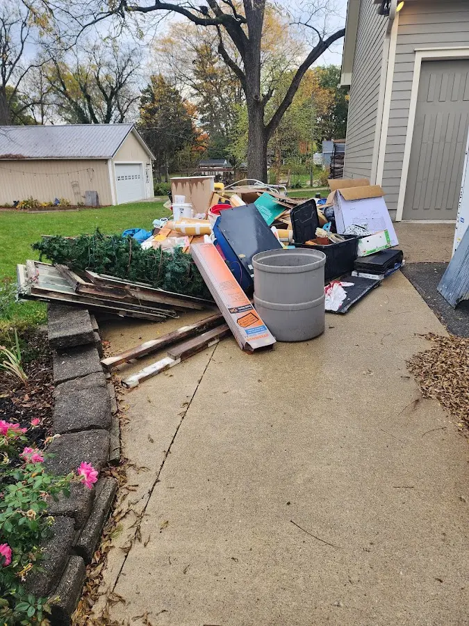 Dumpster being loaded with debris for Commercial Dumpster Rental in Wyoming